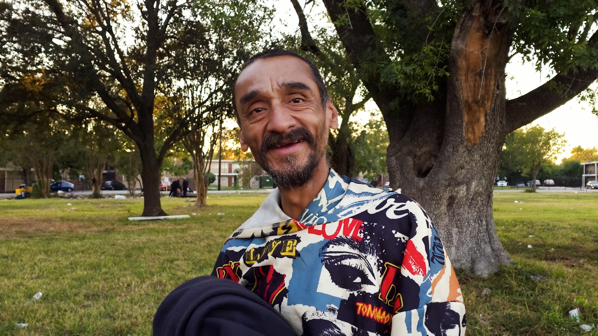 A smiling neighbor during a JC Lives outdoor outreach
