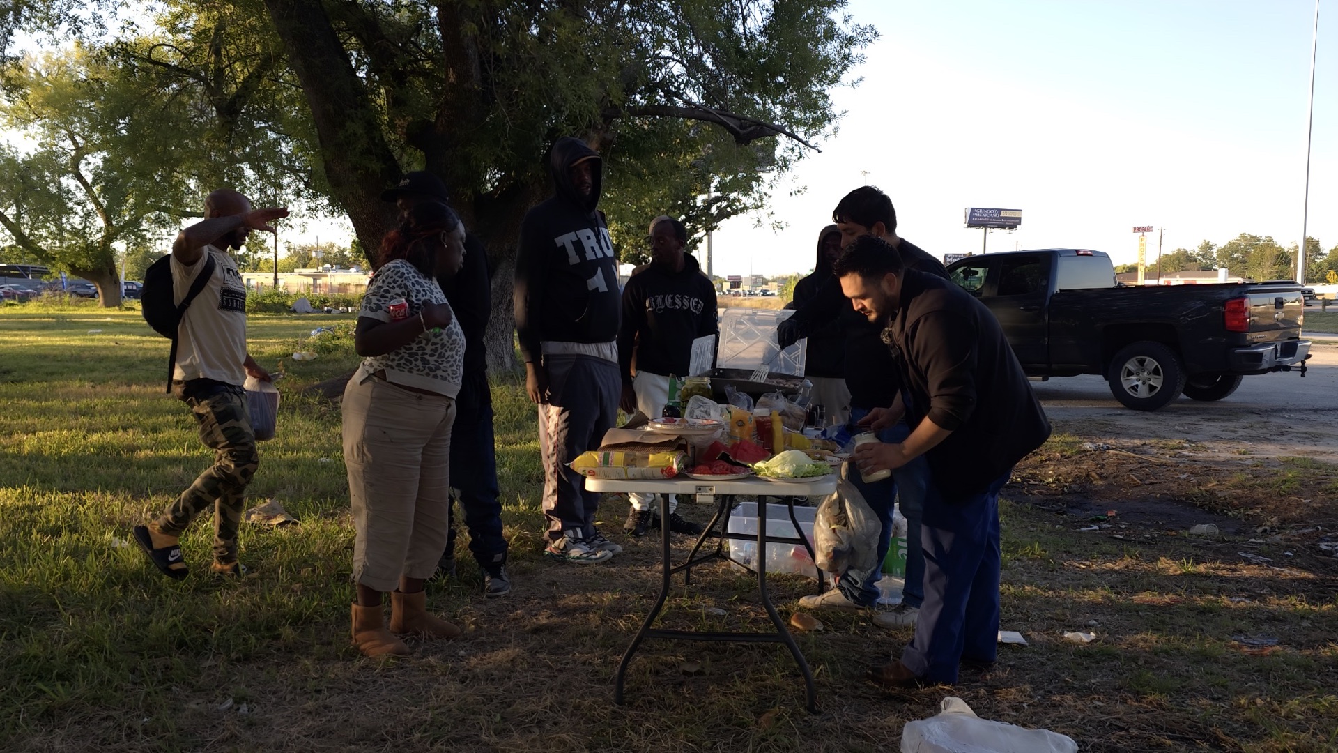 Preparing plates at an outdoor food outreach