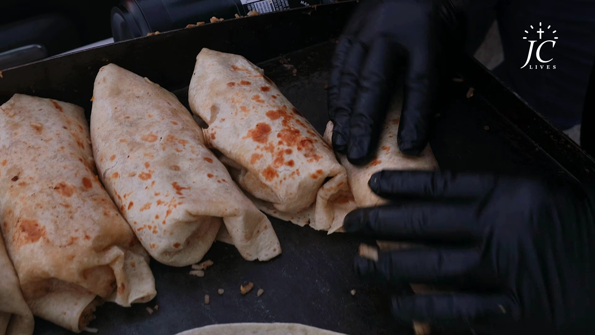 Folding the burritos on the griddle